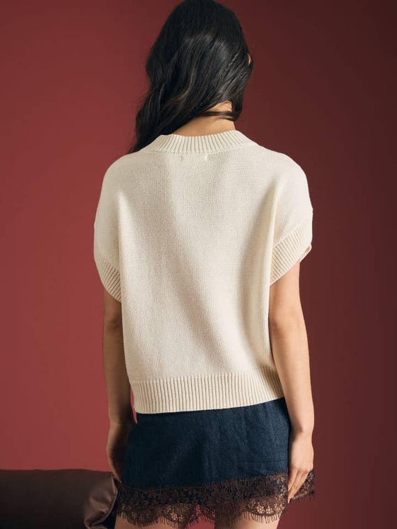 Lifestyle shot of the whimsical dog lover's knit sweater