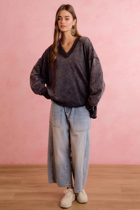 Oversized charcoal mineral wash terry cloth sweatshirt with raw seams and V-neck.