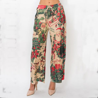 Women's wide leg Christmas print pants, front view, with vintage Santa and reindeer pattern